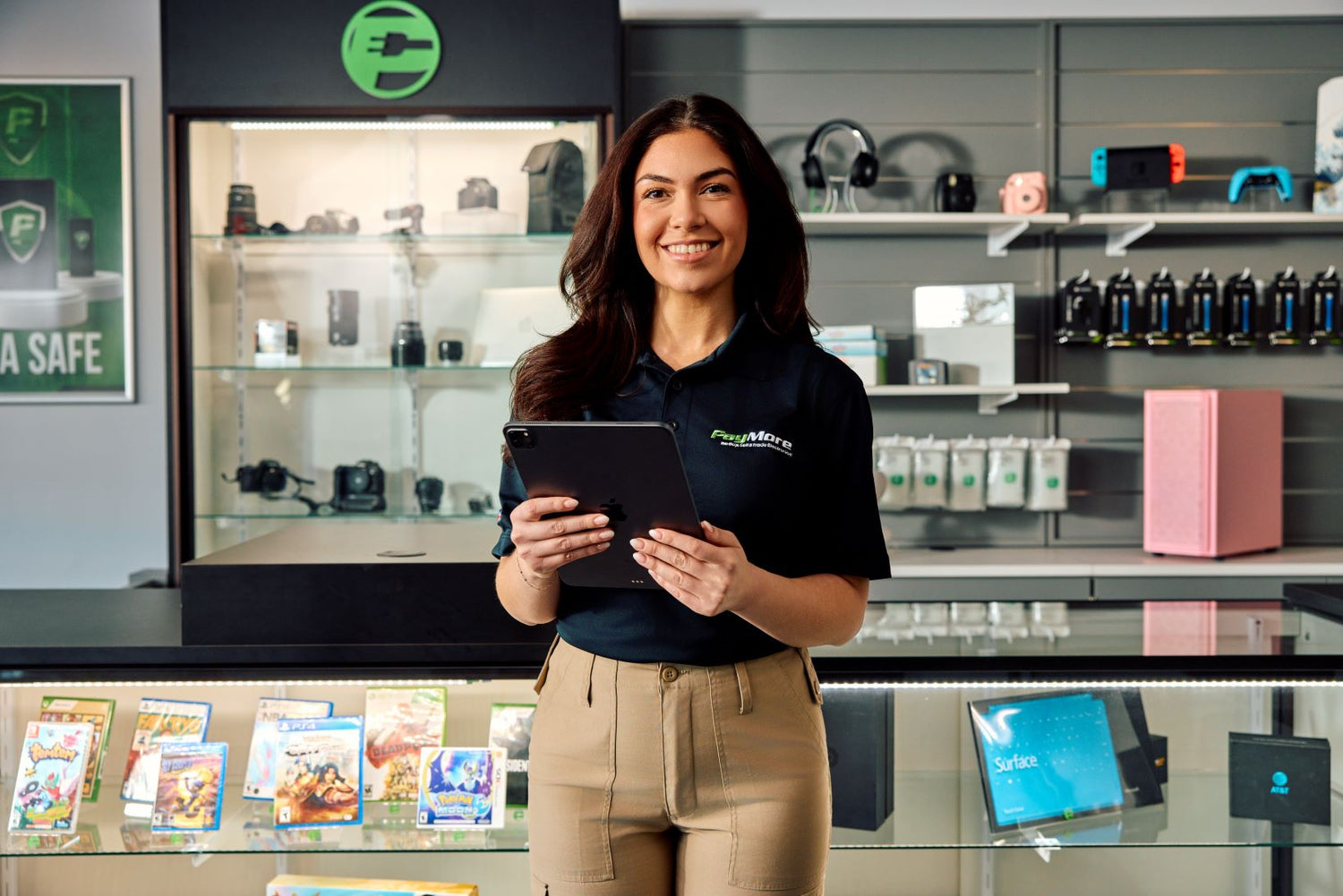 PayMore employee holding a tablet