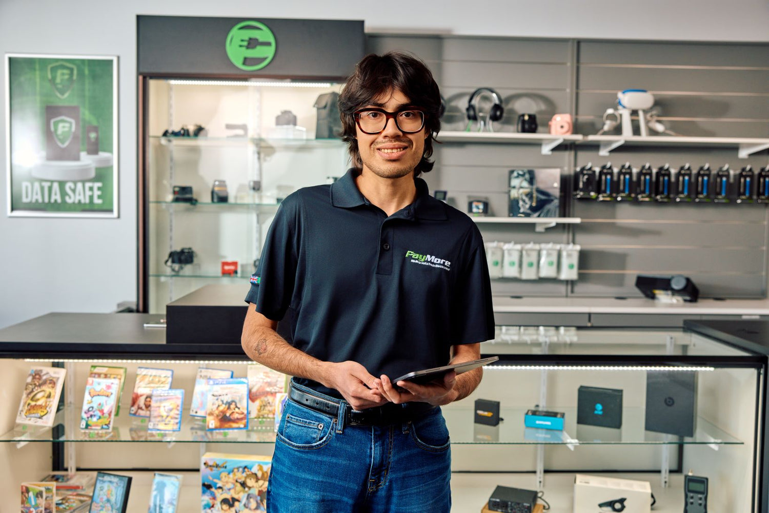 PayMore employee holding a tablet